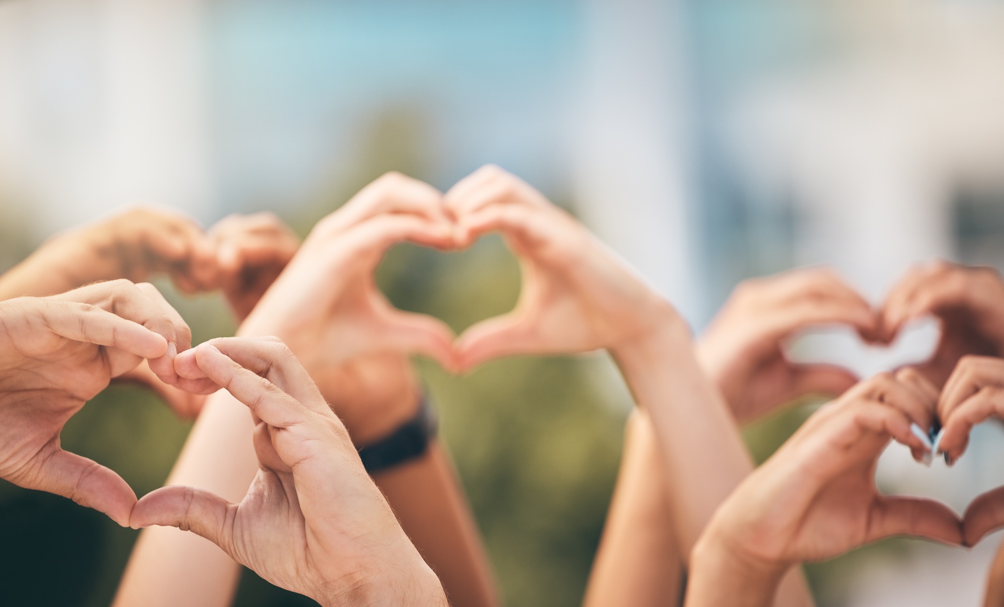 Crowd, hands and heart sign with group of people, community and friends with emoji for care, freedo